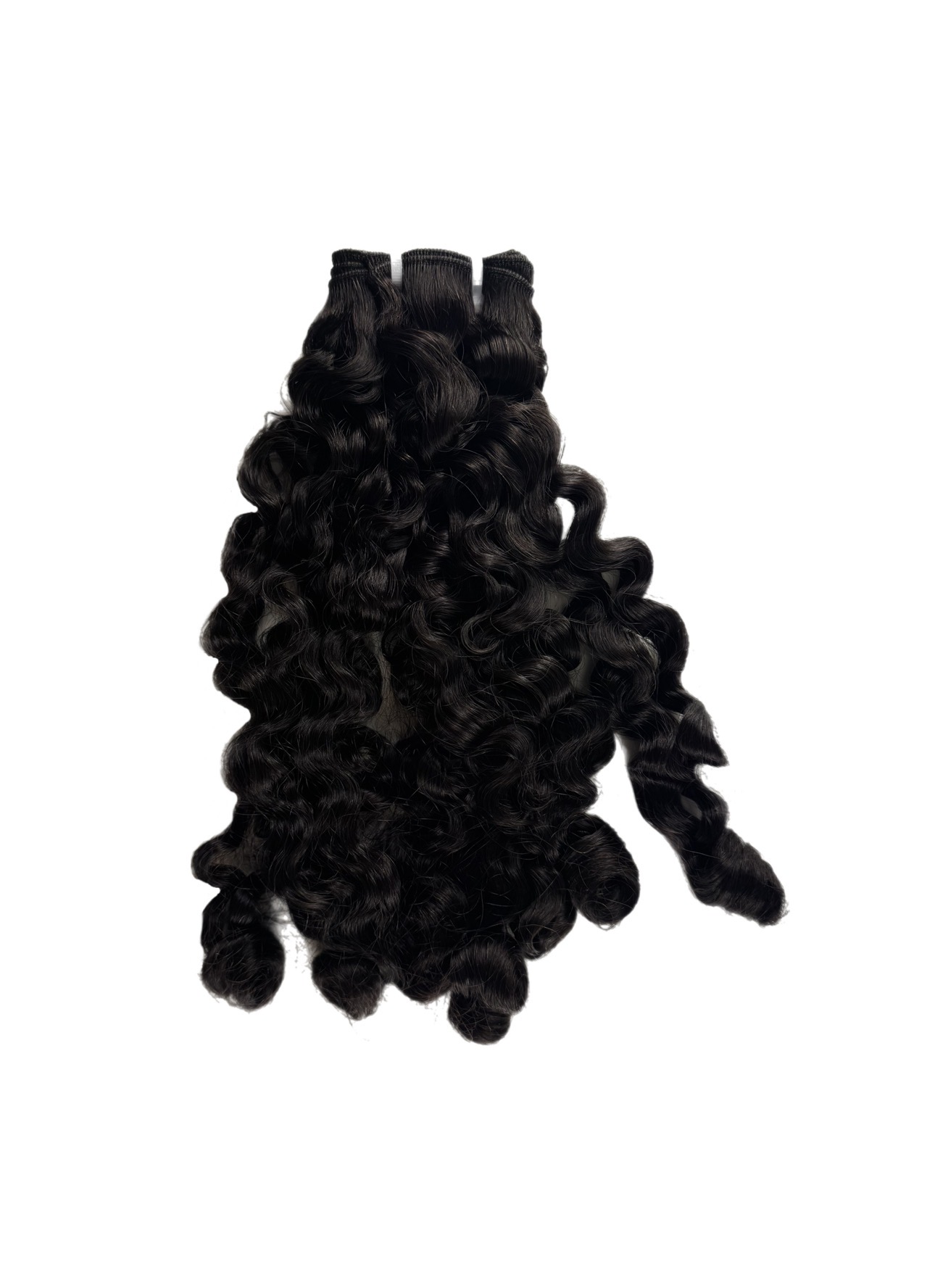 A Caribbean Curly virgin hair bundle photographed on white